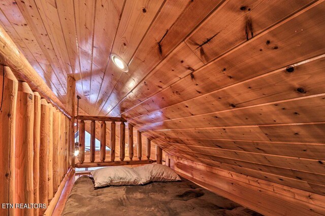 bonus room with wood ceiling and vaulted ceiling