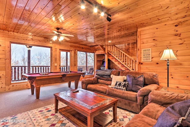 living room featuring wooden ceiling, wood walls, and billiards