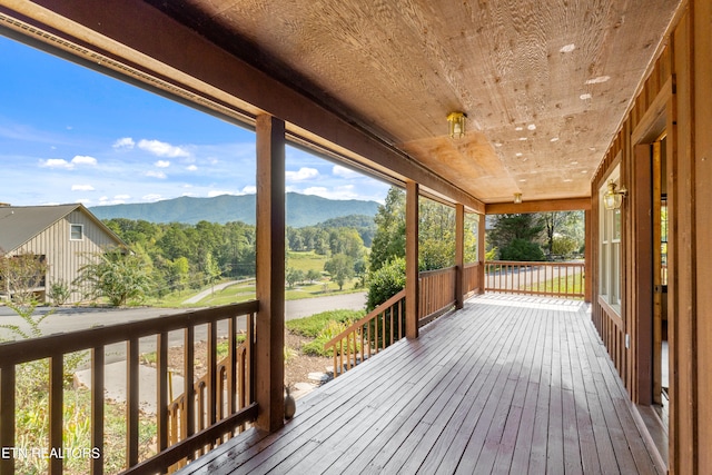 wooden terrace with a mountain view