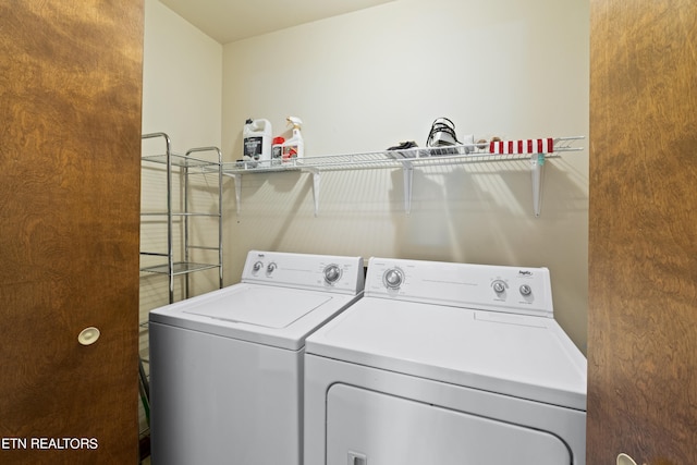 washroom featuring independent washer and dryer