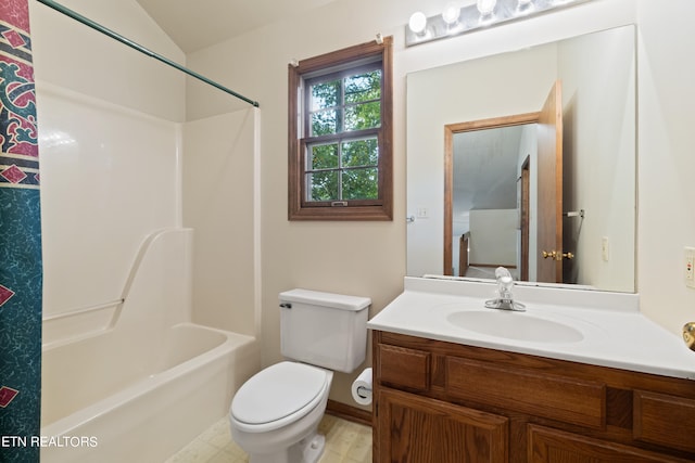 full bathroom featuring washtub / shower combination, vanity, and toilet