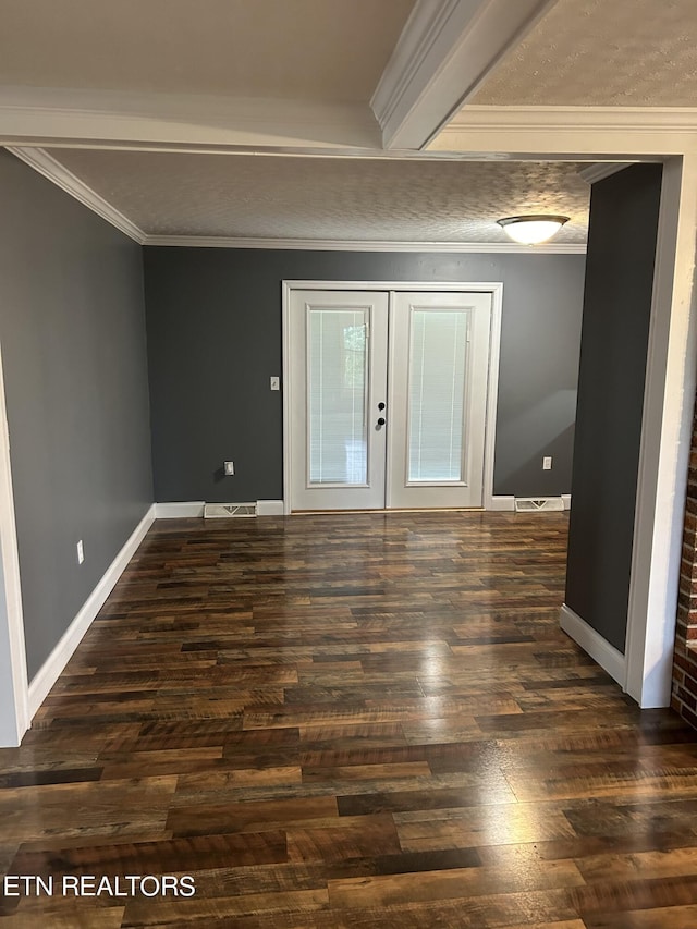 spare room with ornamental molding, dark hardwood / wood-style flooring, and french doors