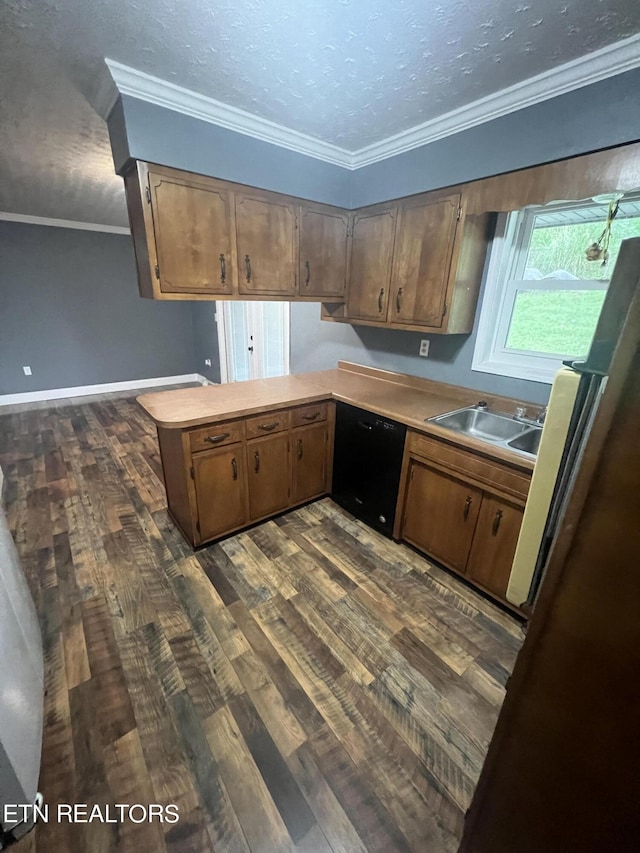 kitchen featuring black dishwasher, dark hardwood / wood-style floors, sink, kitchen peninsula, and ornamental molding