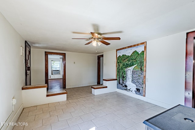 tiled spare room with cooling unit and ceiling fan