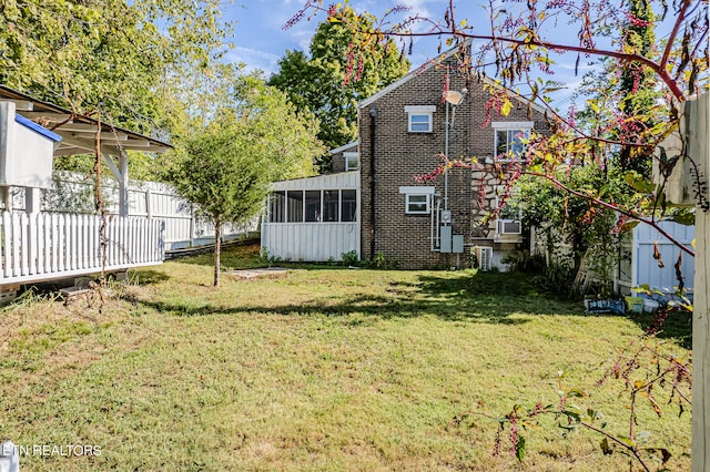 view of yard with a sunroom