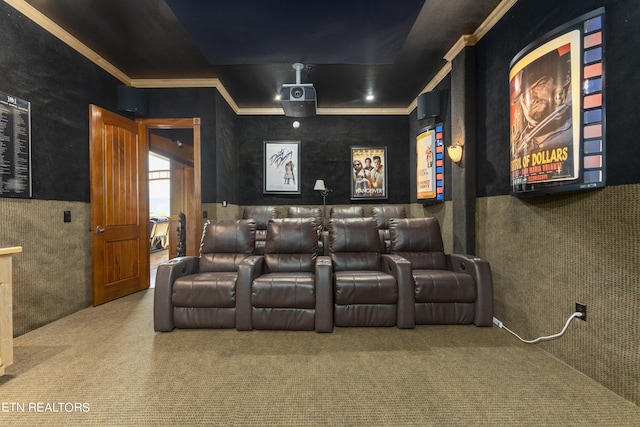 home theater with carpet floors and ornamental molding