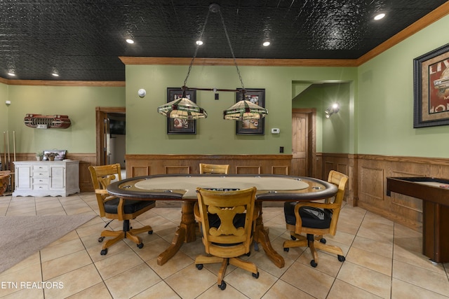 tiled dining area featuring ornamental molding