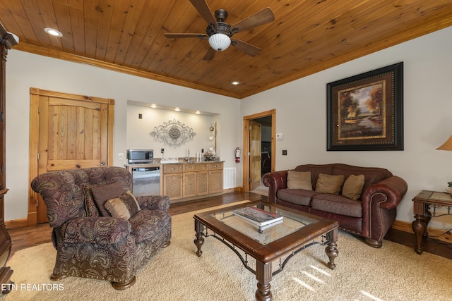 living room featuring ceiling fan, crown molding, and wood ceiling