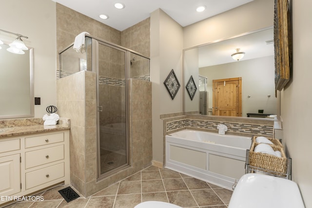 bathroom with vanity, tile patterned floors, and independent shower and bath