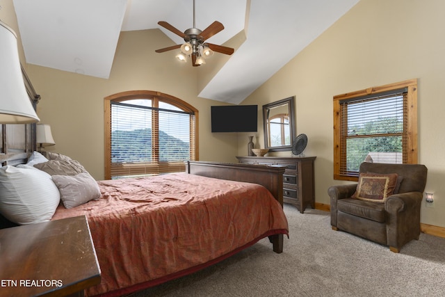 carpeted bedroom featuring multiple windows, high vaulted ceiling, and ceiling fan