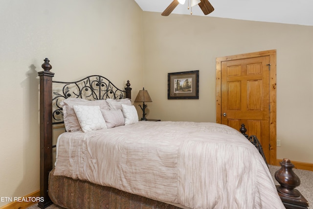 carpeted bedroom featuring vaulted ceiling and ceiling fan