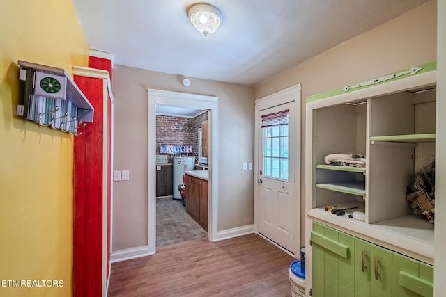 interior space featuring water heater and hardwood / wood-style floors