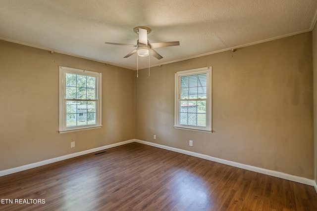 unfurnished room featuring a textured ceiling, ornamental molding, dark wood-type flooring, and ceiling fan