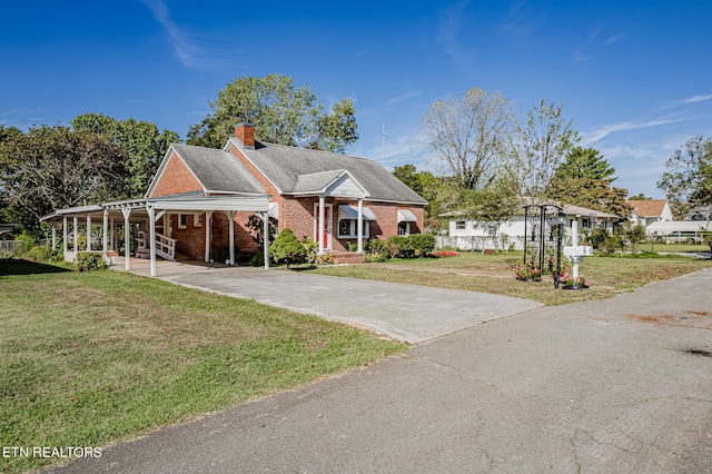 view of front facade featuring a front lawn and a carport