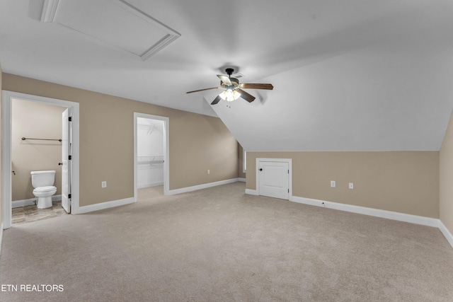 bonus room featuring light carpet, vaulted ceiling, and ceiling fan