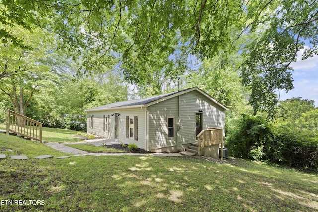 view of home's exterior featuring a yard