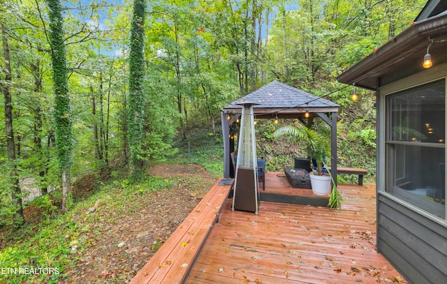 wooden deck featuring a gazebo