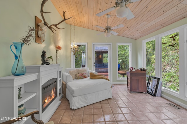 sunroom with wood ceiling, ceiling fan, and lofted ceiling