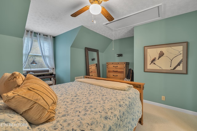 bedroom with lofted ceiling, ceiling fan, carpet floors, and a textured ceiling