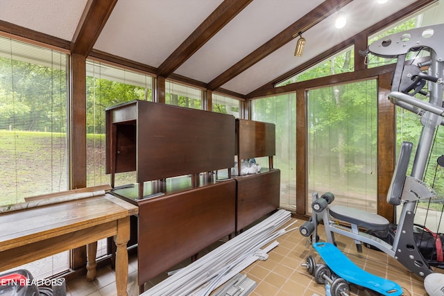 misc room featuring vaulted ceiling with beams and light tile patterned floors