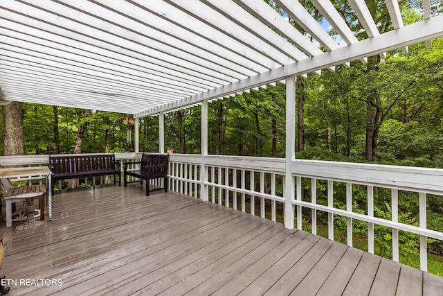 wooden deck featuring a pergola