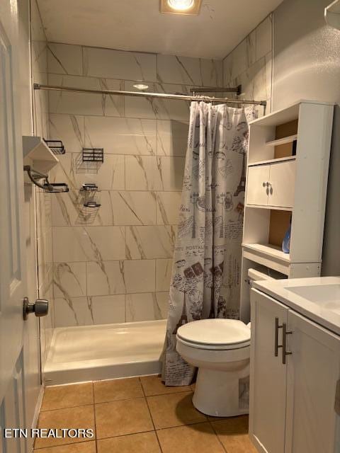 bathroom with vanity, toilet, tile patterned floors, and a shower with curtain