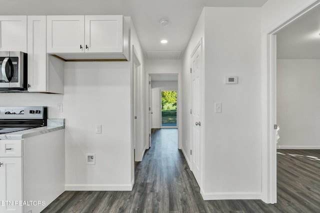 hall with dark wood-type flooring