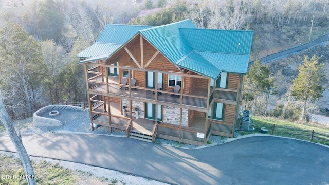 log-style house featuring a balcony