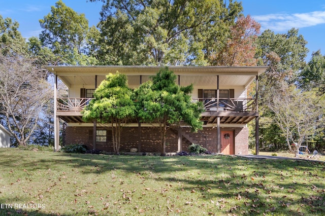 back of house with a yard