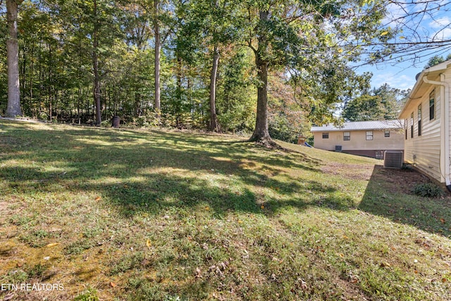 view of yard featuring central AC unit