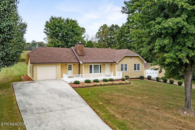 ranch-style home featuring a front lawn, a porch, and a garage