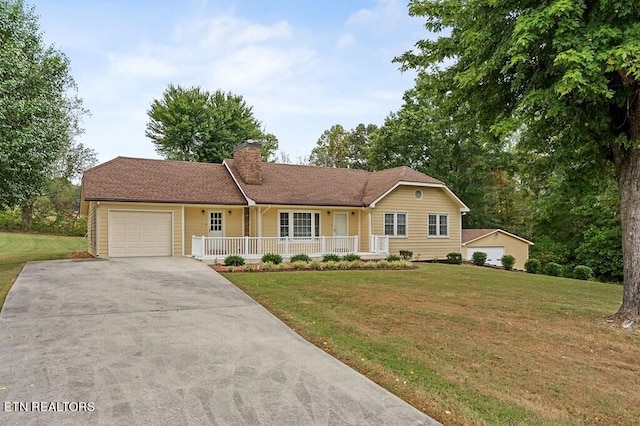 ranch-style home with a garage, a front lawn, and a porch