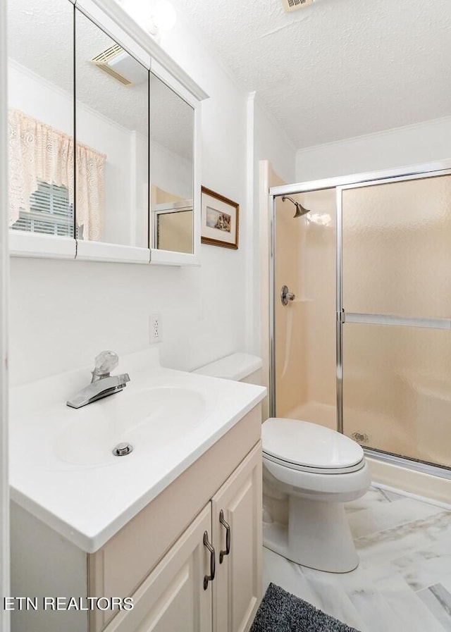 bathroom featuring a textured ceiling, walk in shower, vanity, and toilet