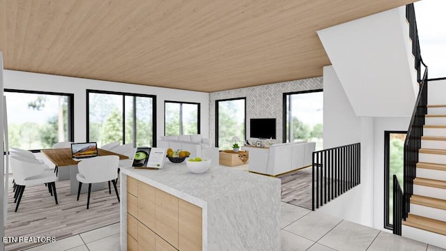 kitchen with wood ceiling, light hardwood / wood-style floors, and light brown cabinets