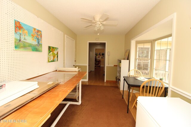 dining room with dark hardwood / wood-style floors and ceiling fan