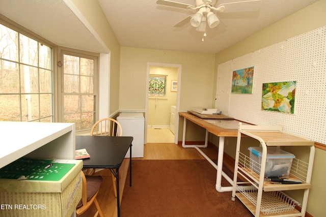 office with a textured ceiling, hardwood / wood-style floors, and ceiling fan