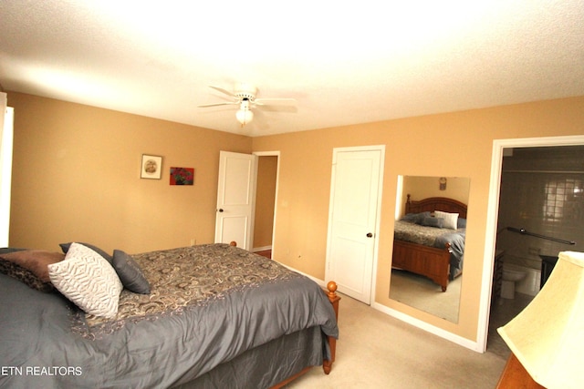 bedroom with a ceiling fan, light carpet, and baseboards