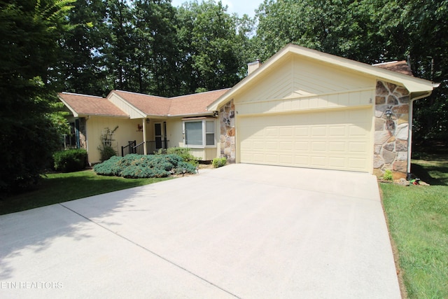 ranch-style home featuring an attached garage, stone siding, driveway, a front lawn, and a chimney