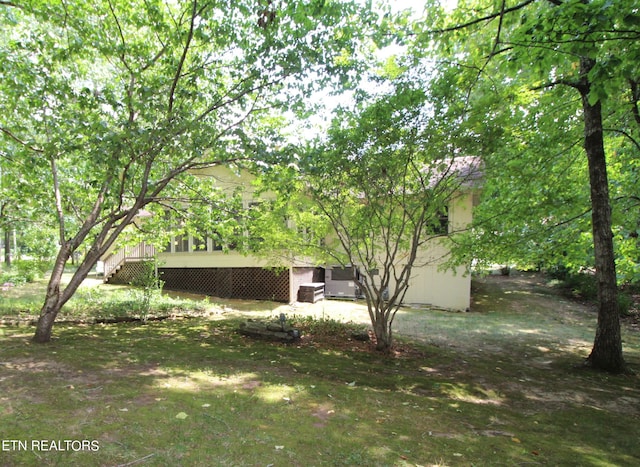 view of yard featuring a wooden deck