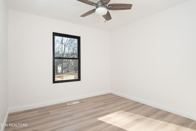 empty room featuring light hardwood / wood-style floors and ceiling fan