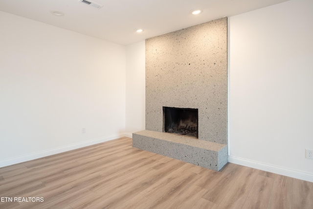 unfurnished living room with light hardwood / wood-style flooring