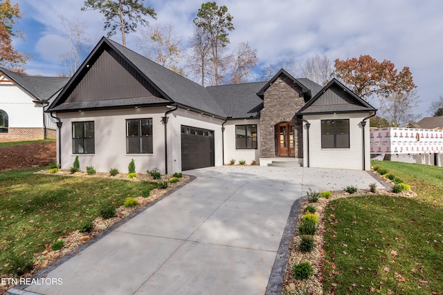 modern inspired farmhouse with a garage, brick siding, concrete driveway, and a front yard