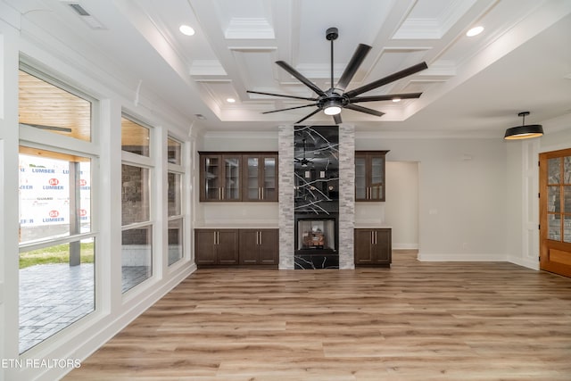 200 Kawga Ln, Loudon, TN 37774 - unfurnished living room with light wood-style flooring, crown molding, coffered ceiling, a ceiling fan, and a high end fireplace