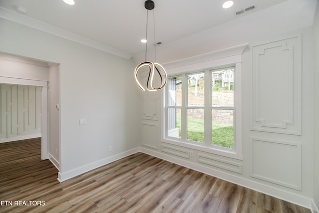 unfurnished dining area with baseboards, visible vents, wood finished floors, and recessed lighting