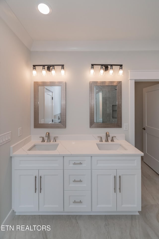 bathroom featuring a sink and double vanity