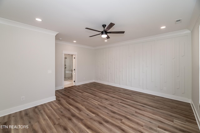 unfurnished room with baseboards, ornamental molding, wood finished floors, and recessed lighting