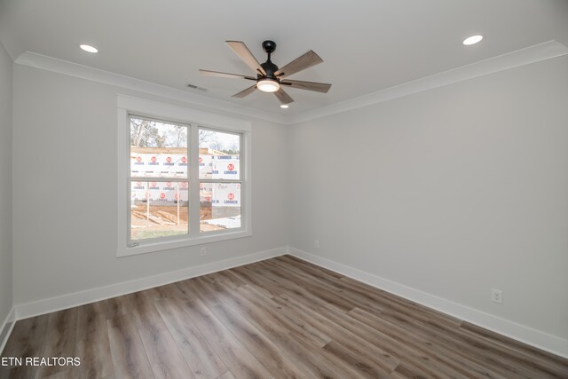 unfurnished room with baseboards, crown molding, and recessed lighting