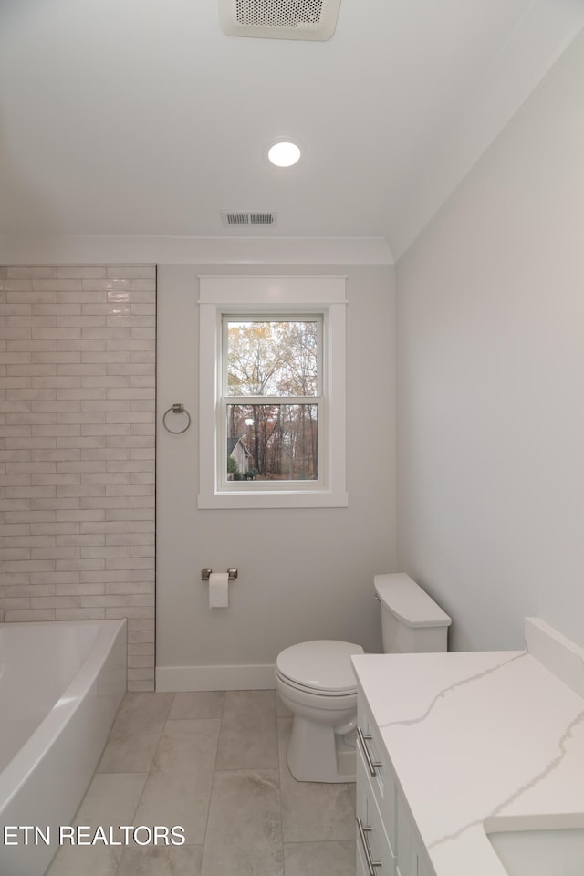 bathroom featuring toilet, visible vents, a bath, and ornamental molding