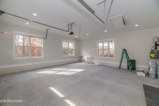 garage with recessed lighting and a garage door opener