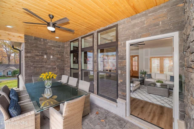 view of patio / terrace with ceiling fan, an outdoor hangout area, and outdoor dining space